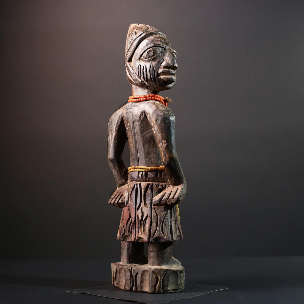 African statue Yoruba carved female figure from Nigeria with beads, tribal details, and dark finish for spiritual home decor G5561