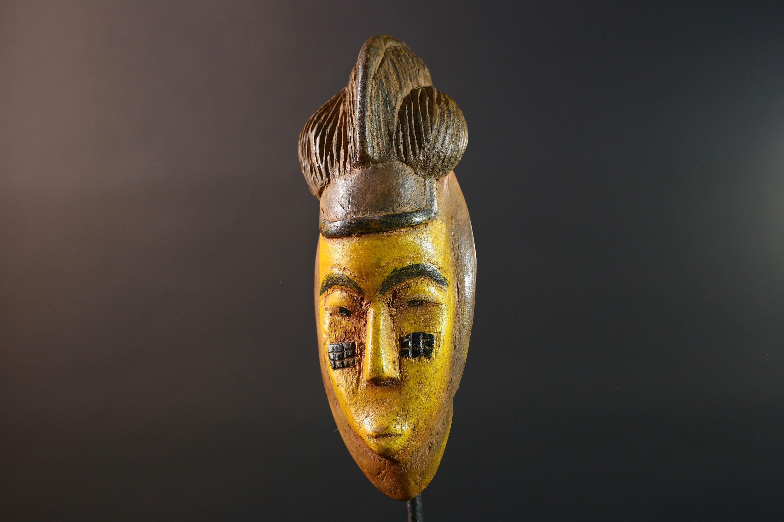 African mask Baule yellow wall sculpture tribal face carving cultural artifact leaf crest decor artisan African wood art piece G5565