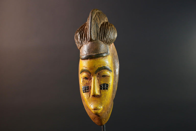 African mask Baule yellow wall sculpture tribal face carving cultural artifact leaf crest decor artisan African wood art piece G5565