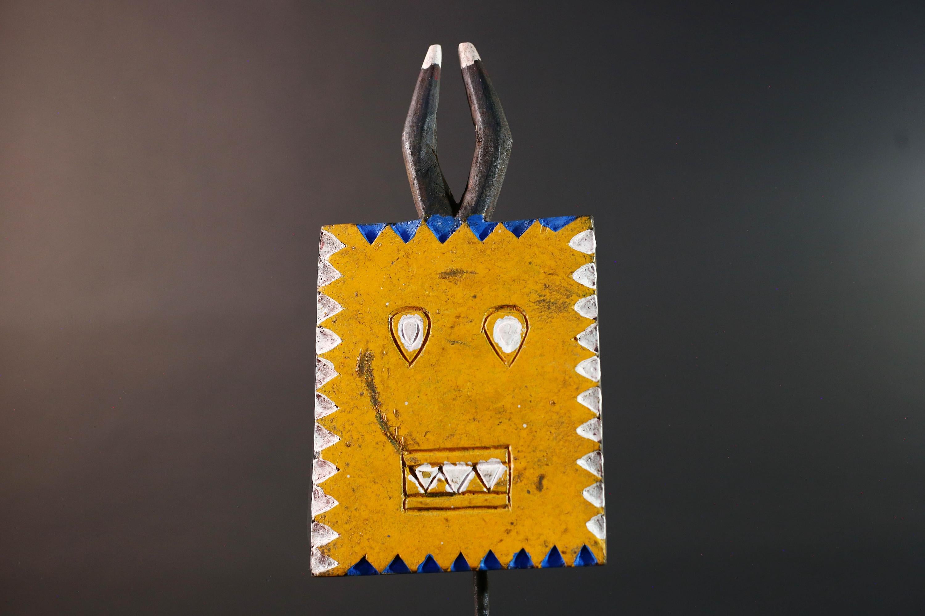 African wall decor Bwa tribal sun mask yellow geometric face with blue white painted motifs and pronged crest cultural home display G5496
