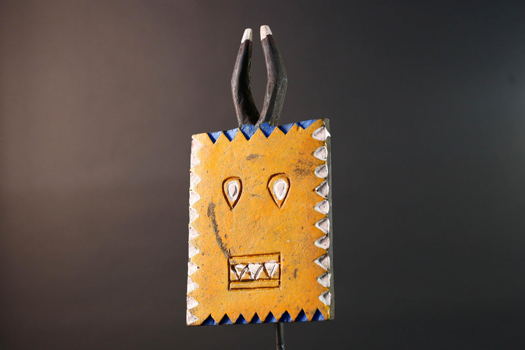 African wall decor Bwa tribal sun mask yellow geometric face with blue white painted motifs and pronged crest cultural home display G5496