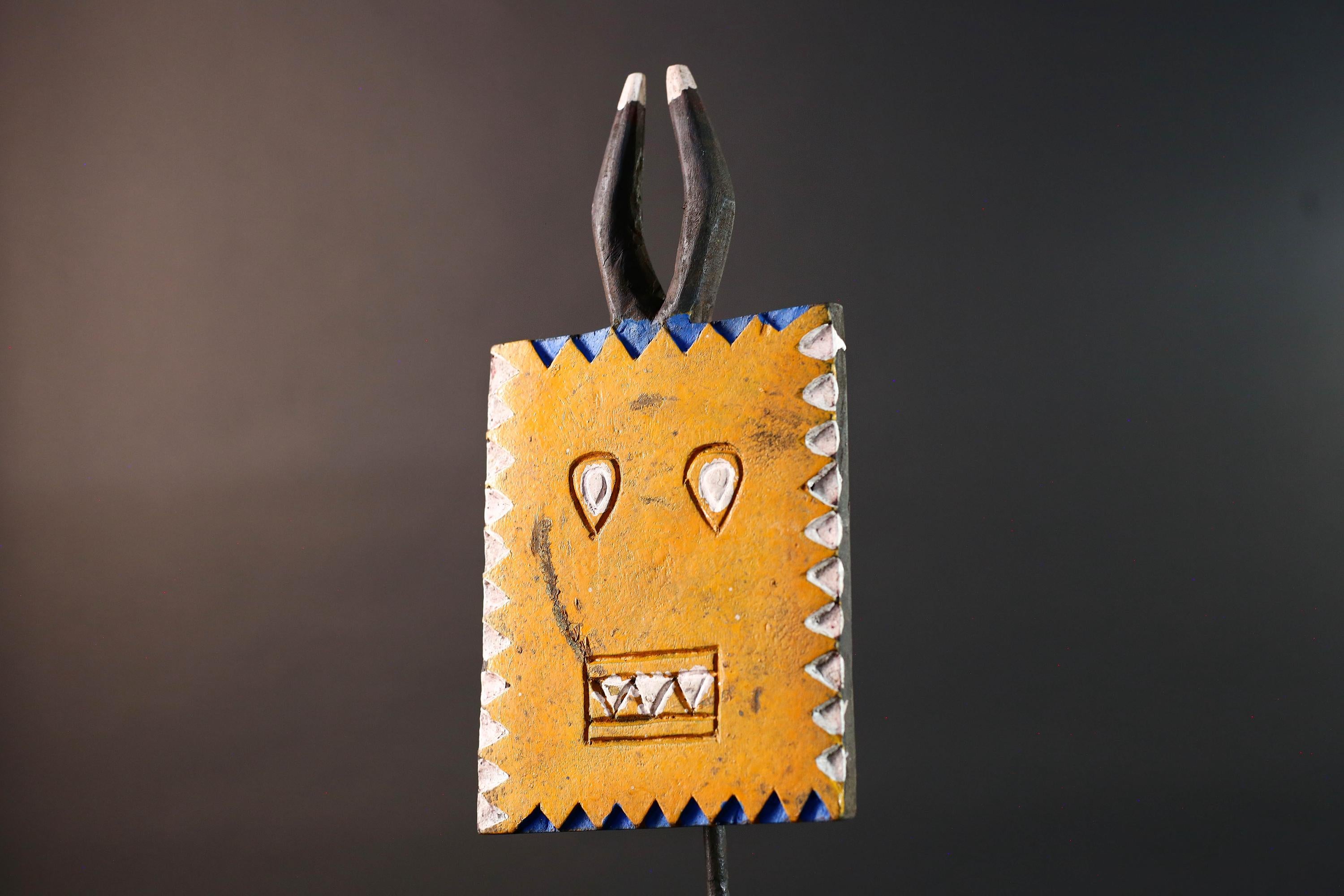 African wall decor Bwa tribal sun mask yellow geometric face with blue white painted motifs and pronged crest cultural home display G5496