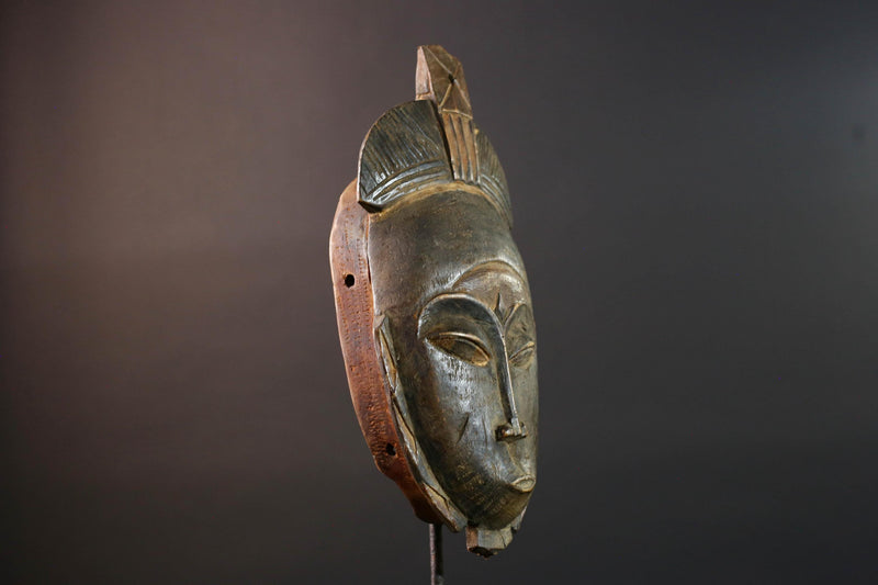 African wall decor Baule tribal mask with downcast eyes geometric accents and tall domed crest for symbolic interior statement piece G5498