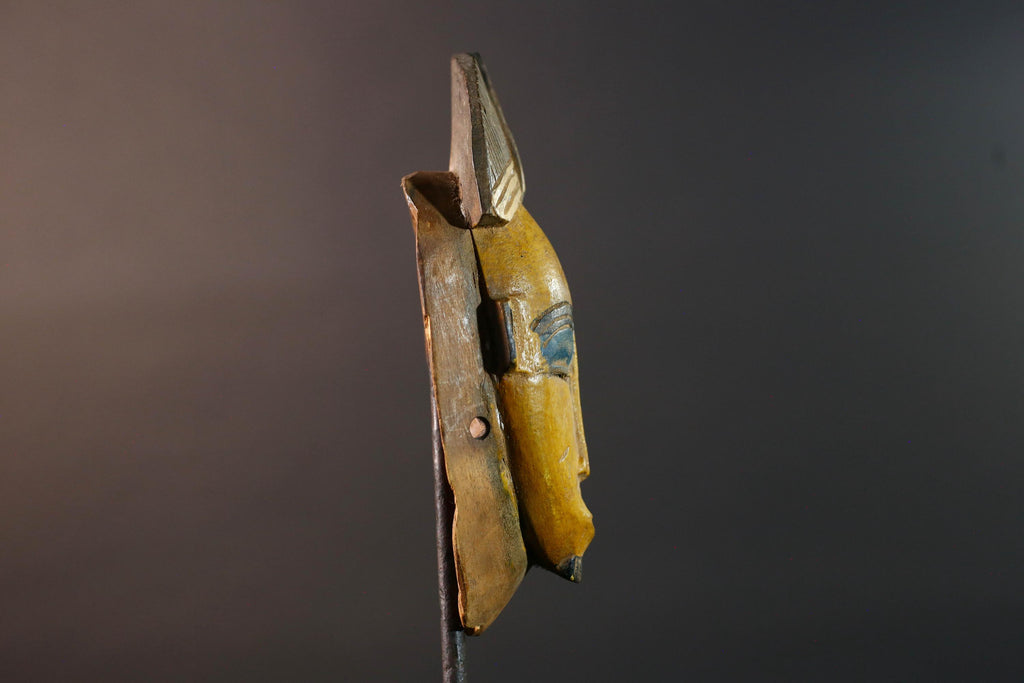Baule tribal wall decor mask with yellow face blue brow ridged crest and scarified cheeks for african spiritual home interior design G5500