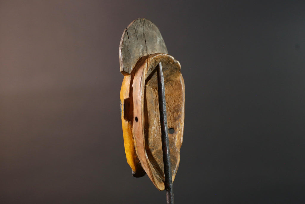 Baule tribal wall decor mask with yellow face blue brow ridged crest and scarified cheeks for african spiritual home interior design G5500