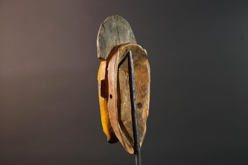 Baule tribal wall decor mask with yellow face blue brow ridged crest and scarified cheeks for african spiritual home interior design G5500