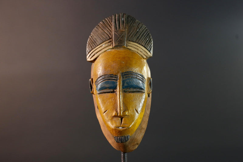 Baule tribal wall decor mask with yellow face blue brow ridged crest and scarified cheeks for african spiritual home interior design G5500