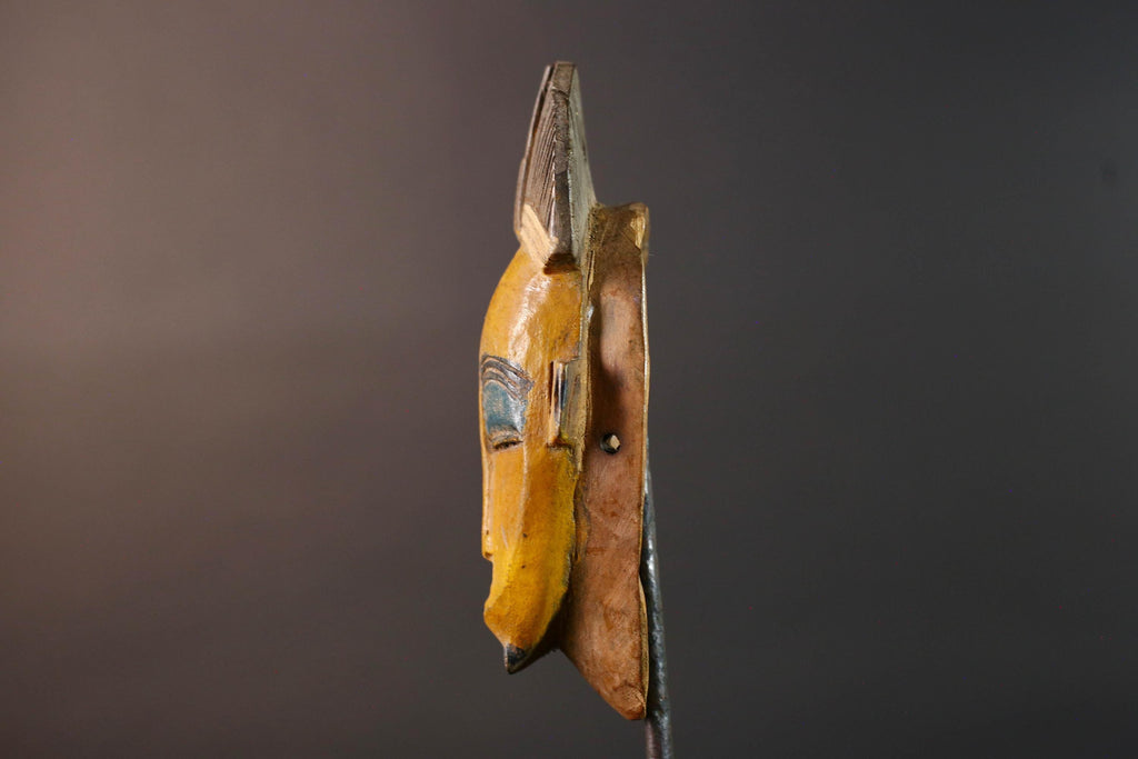 Baule tribal wall decor mask with yellow face blue brow ridged crest and scarified cheeks for african spiritual home interior design G5500
