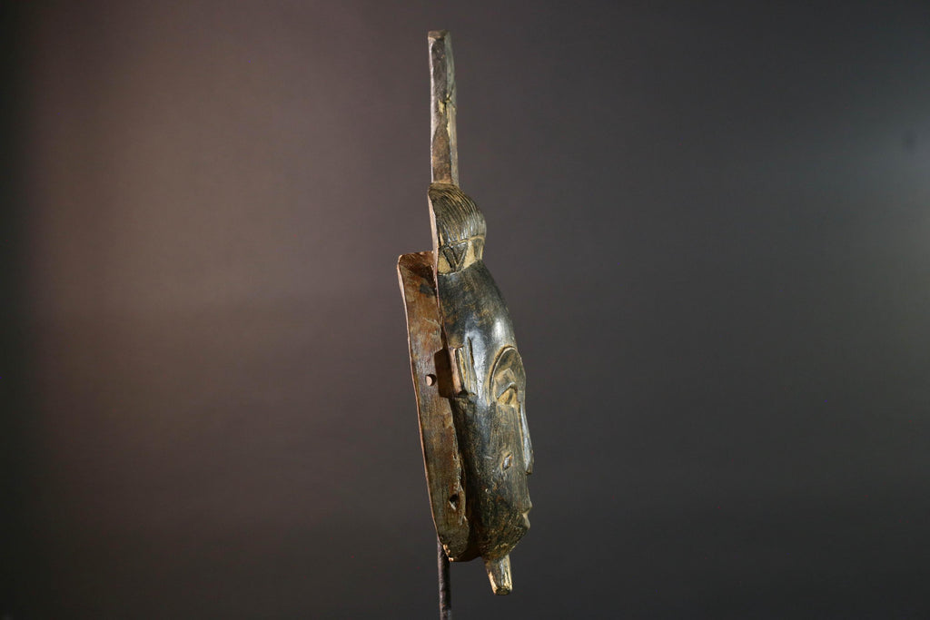 Africa tribal wall mask Baule carving with tall ridged crest narrow face and symbolic cheek marks for spiritual interior statement art G5502