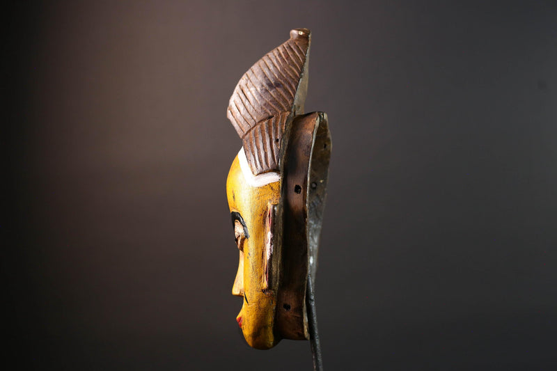 Yellow African tribal mask hand carved wood wall sculpture with cowrie shells leather crest folk figure symbolic ethnic home decor-G5522