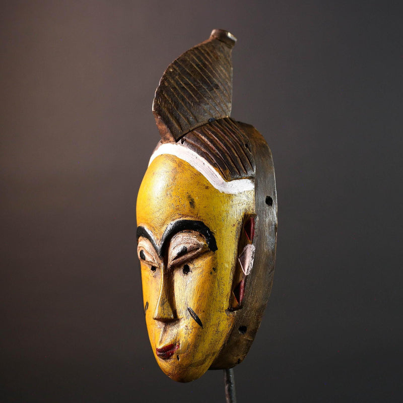 Yellow African tribal mask hand carved wood wall sculpture with cowrie shells leather crest folk figure symbolic ethnic home decor-G5522
