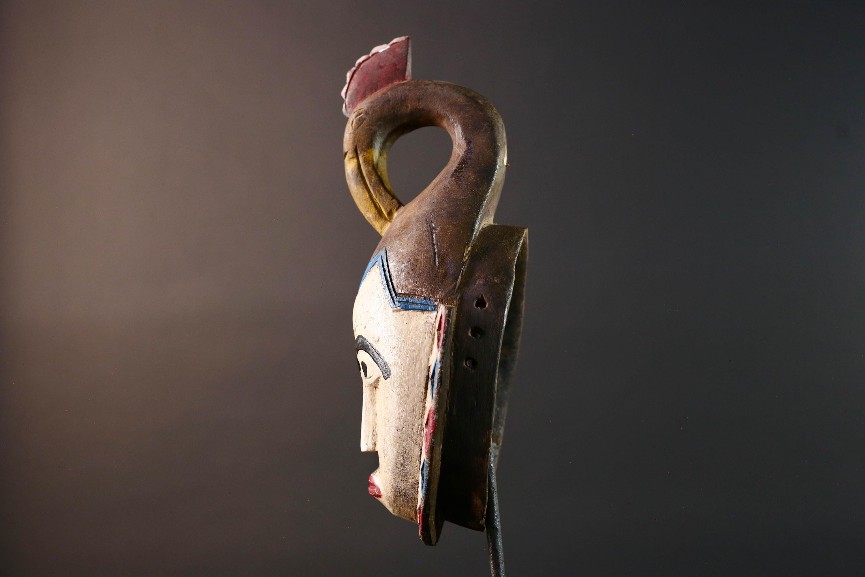 African tribal mask Guro carved wood wall decor with pale face red lips arched brow animal crest artisan symbolic ethnic sculpture-G5519