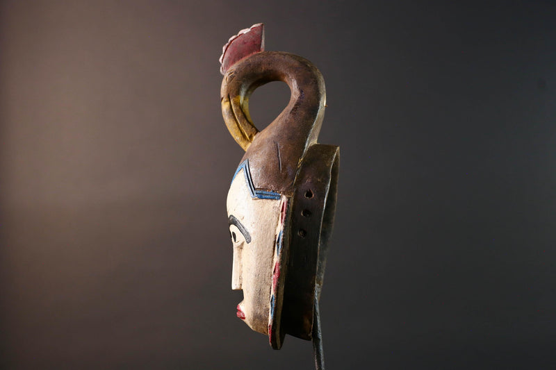 African tribal mask Guro carved wood wall decor with pale face red lips arched brow animal crest artisan symbolic ethnic sculpture-G5519