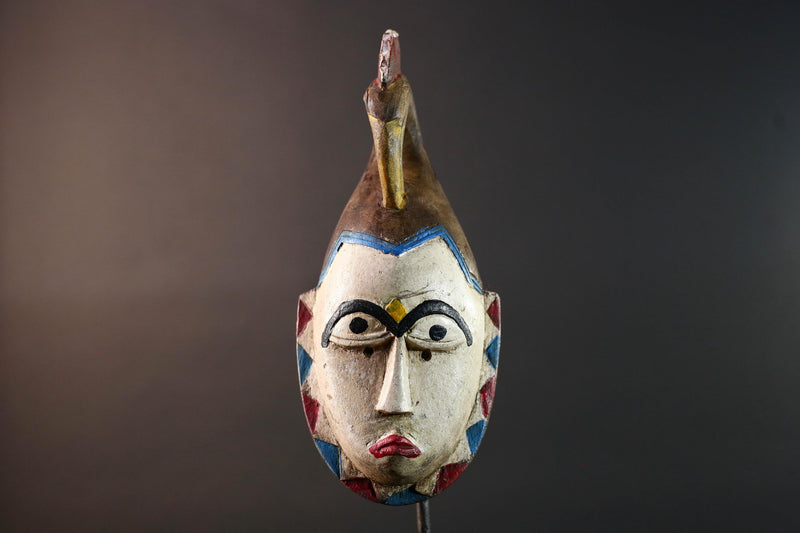African tribal mask Guro carved wood wall decor with pale face red lips arched brow animal crest artisan symbolic ethnic sculpture-G5519