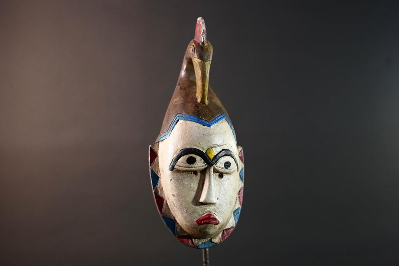 African tribal mask Guro carved wood wall decor with pale face red lips arched brow animal crest artisan symbolic ethnic sculpture-G5519