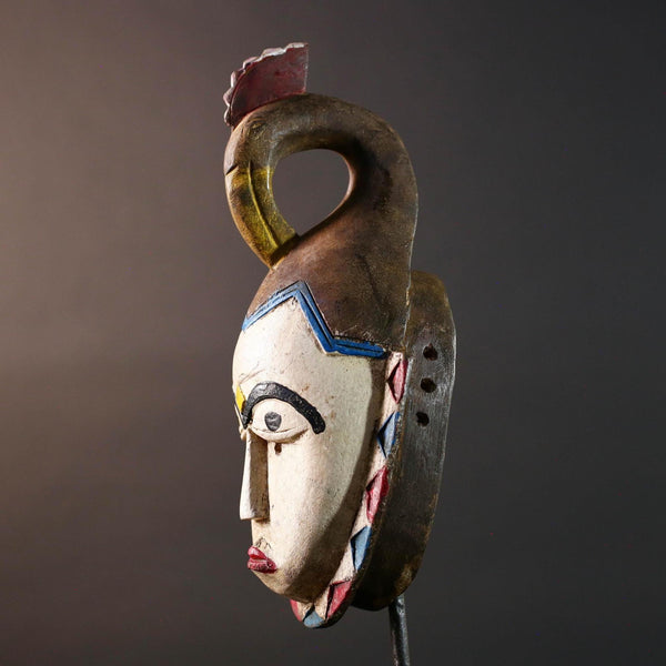African tribal mask Guro carved wood wall decor with pale face red lips arched brow animal crest artisan symbolic ethnic sculpture-G5519