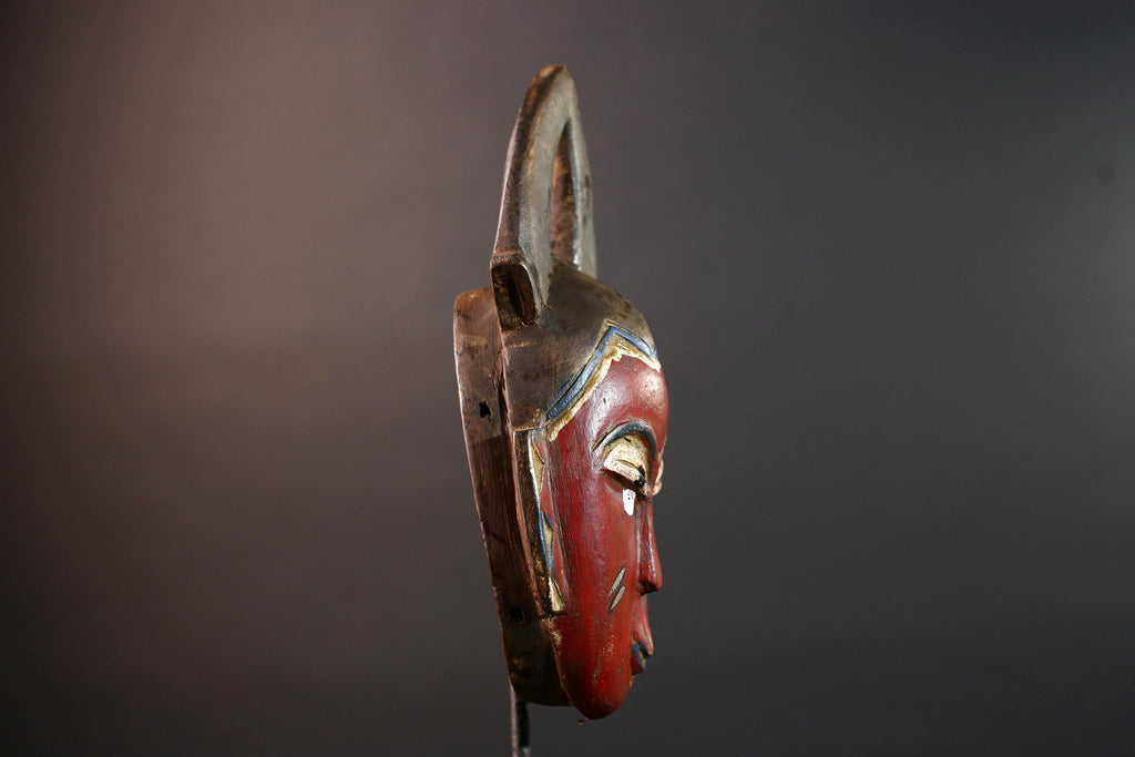 African tribal mask Guro carved wood wall decor with red face double horn crest stylized eyes artisan figure symbolic ethnic art-G5518