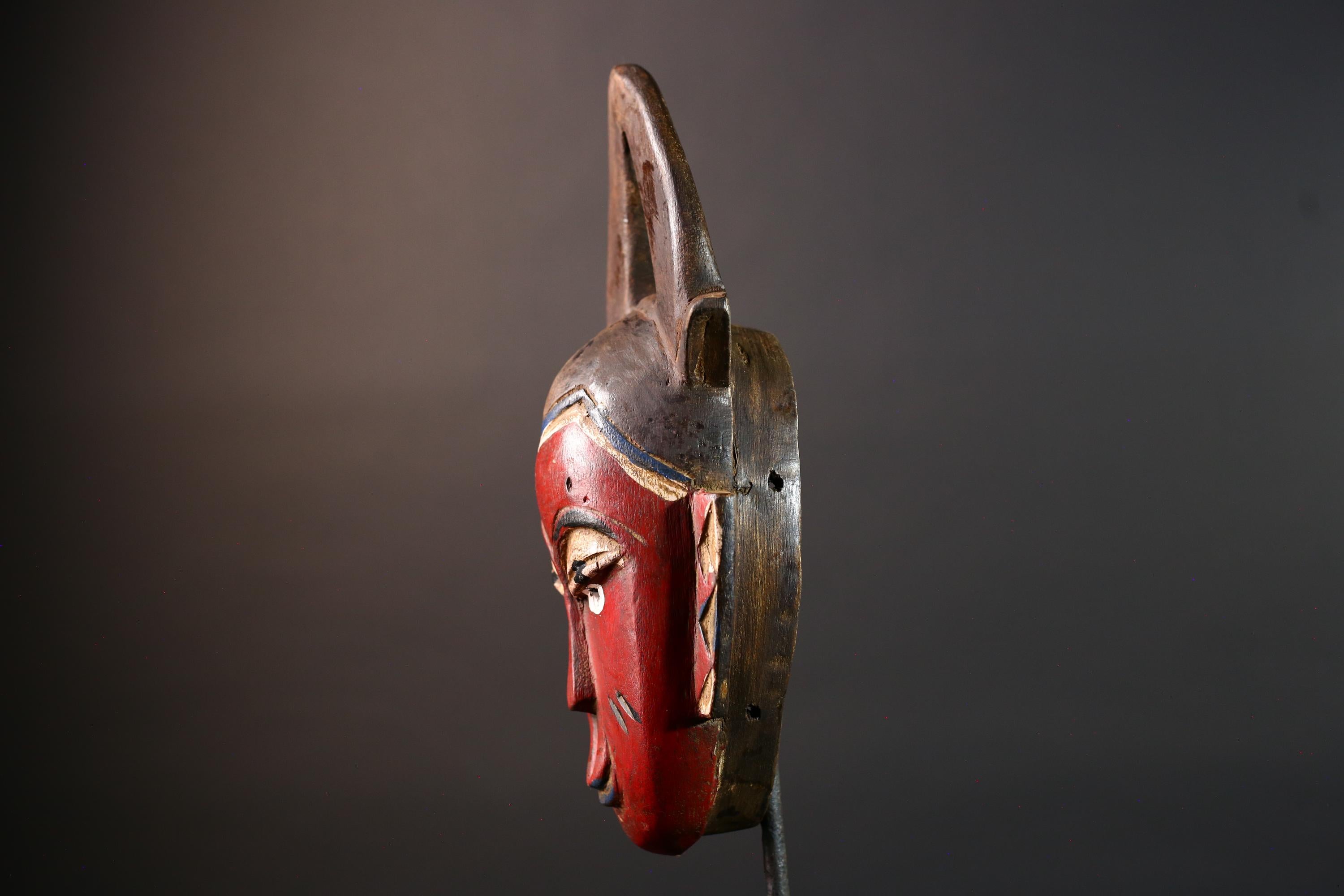 African tribal mask Guro carved wood wall decor with red face double horn crest stylized eyes artisan figure symbolic ethnic art-G5518