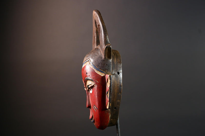 African tribal mask Guro carved wood wall decor with red face double horn crest stylized eyes artisan figure symbolic ethnic art-G5518