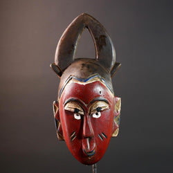 African tribal mask Guro carved wood wall decor with red face double horn crest stylized eyes artisan figure symbolic ethnic art-G5518