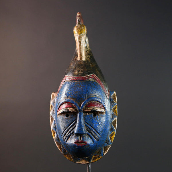 African tribal mask Guro carved wood wall decor with blue face bird crest scarification red white eyelids artisan symbolic sculpture-G5517