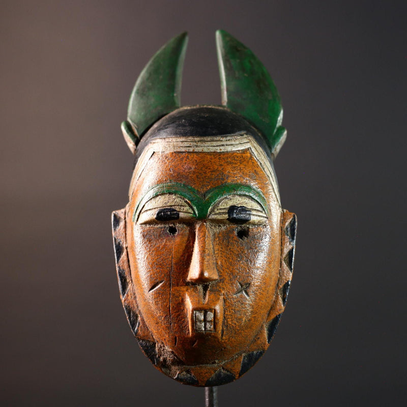 African mask Guro tribe orange face wall sculpture with green horn crest carved tribal cheek marks ethnic wood home art decor-G5542