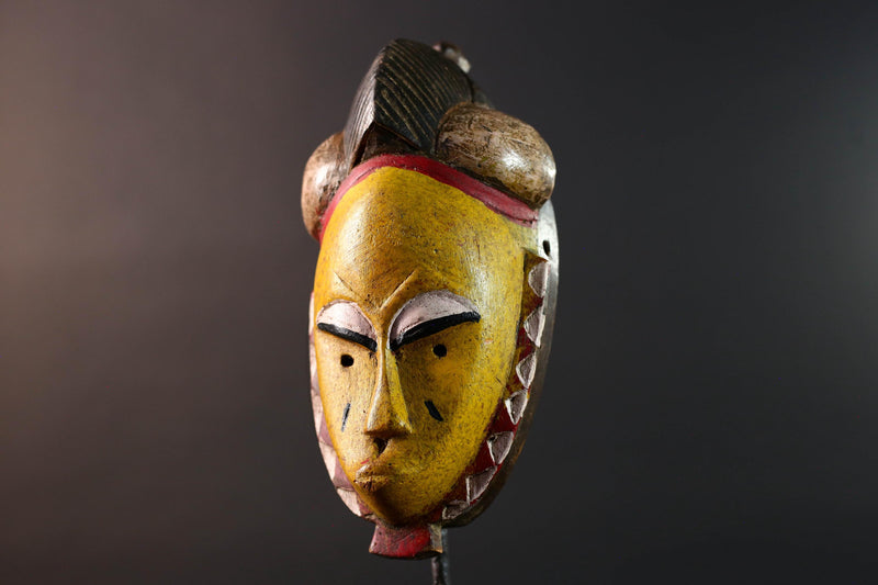 African mask Baule tribe yellow face carved wood with almond eyes rounded side buns geometric cheeks and central crest wall decor-G5539