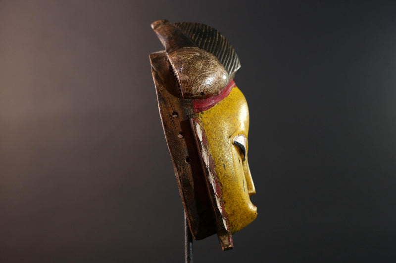 African mask Baule tribe yellow face carved wood with almond eyes rounded side buns geometric cheeks and central crest wall decor-G5539