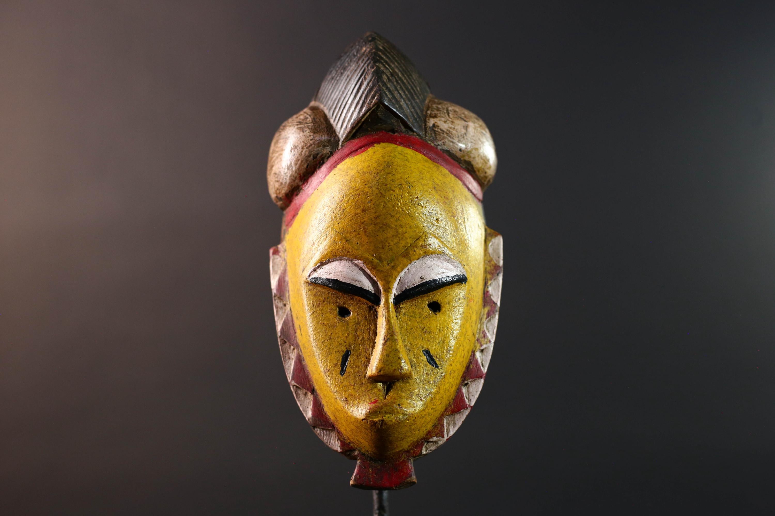 African mask Baule tribe yellow face carved wood with almond eyes rounded side buns geometric cheeks and central crest wall decor-G5539
