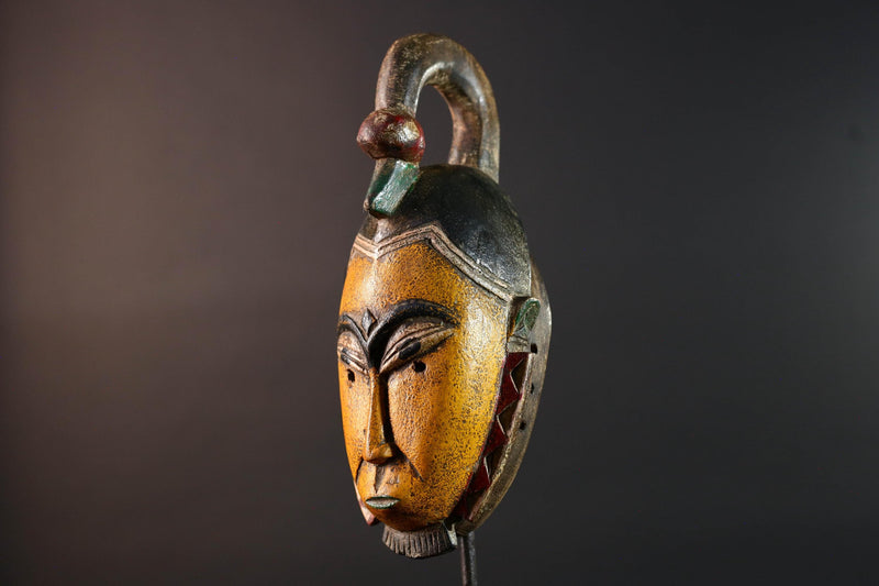 African mask Guro carving yellow face with animal crest red white triangle trim tribal wall decor wood sculpture spiritual art-G5548