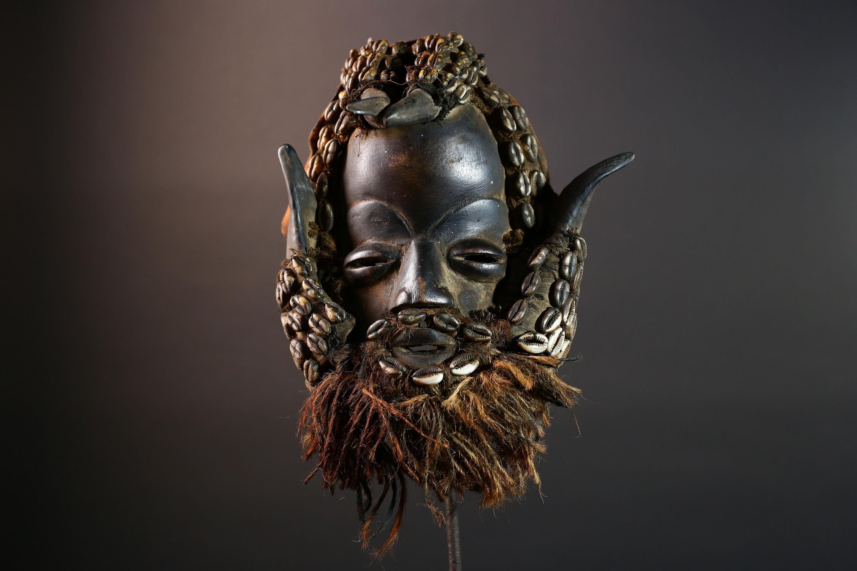 African Dan Cowrie Shell Mask Hand Carved Hardwood Ritual Art Decor from Ivory Coast with Buffalo Horn Accents for Home Display-G5650