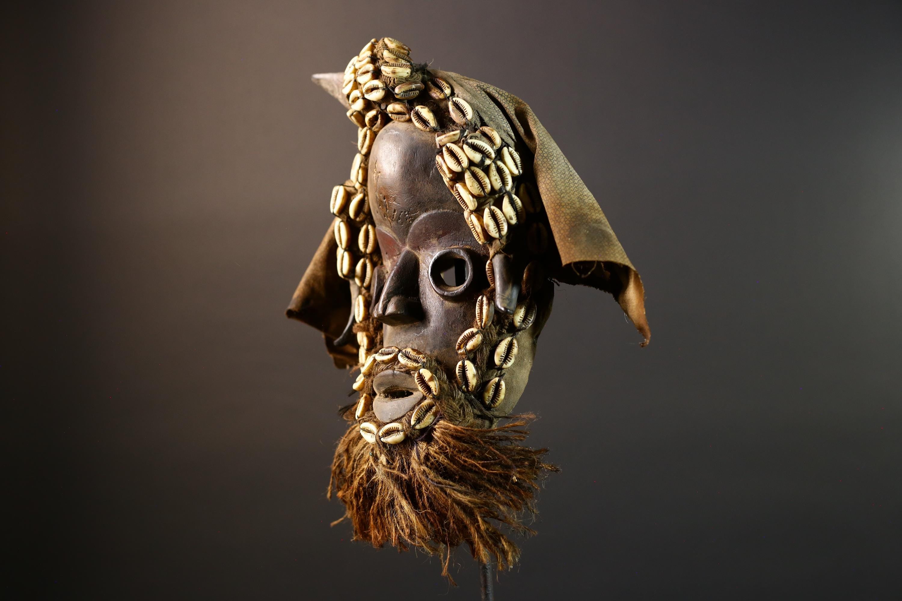 African Dan Mask Handcrafted Tribal Wood Wall Decor Authentic Cultural Art Sculpture with Cowrie Shells and Raffia Beard-G5693