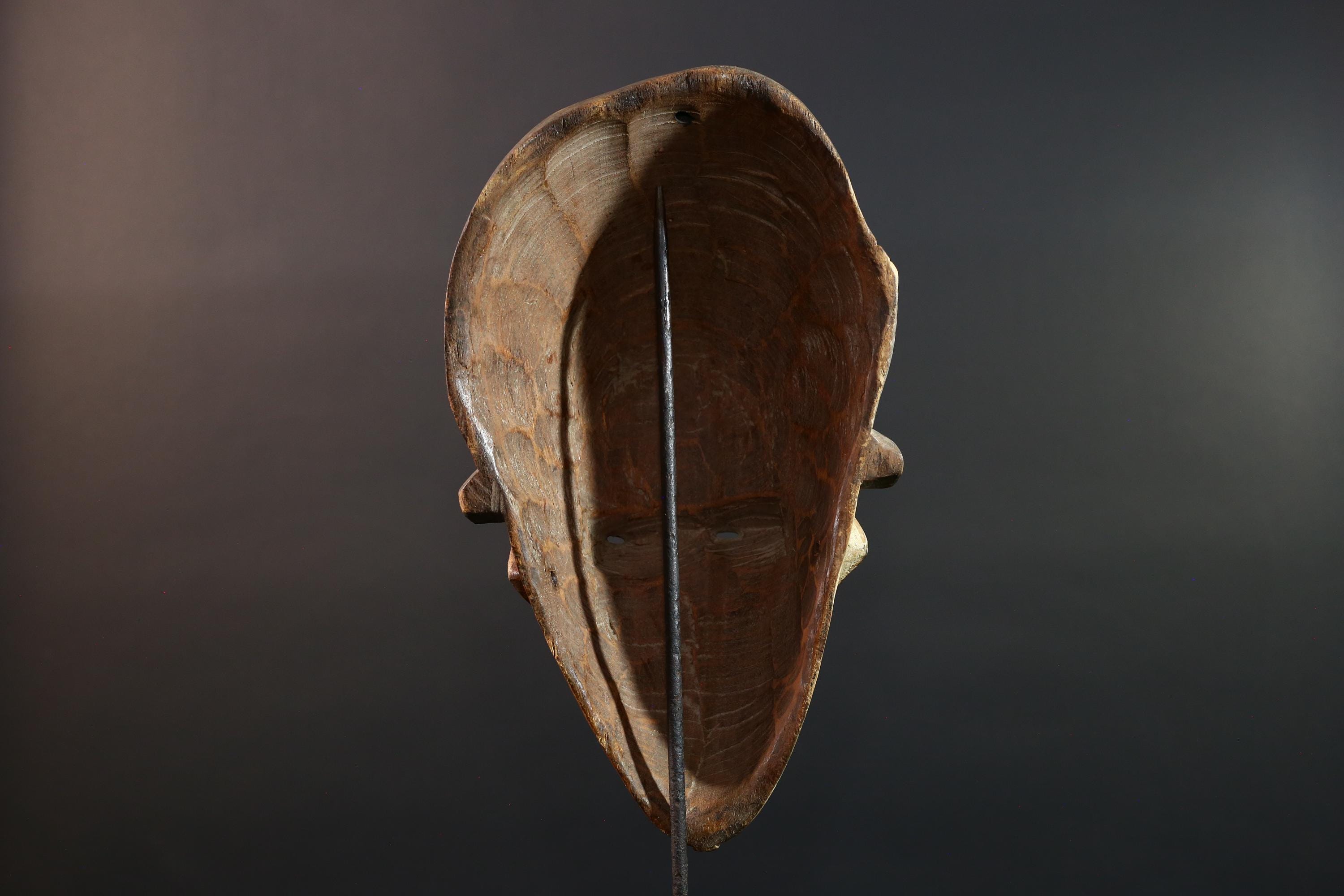 Hand carved African Punu mask tribal wall decor with kaolin white face and tall braided crest art from Central Africa G5569