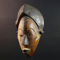 Hand carved African Punu mask tribal wall decor with kaolin white face and tall braided crest art from Central Africa G5569
