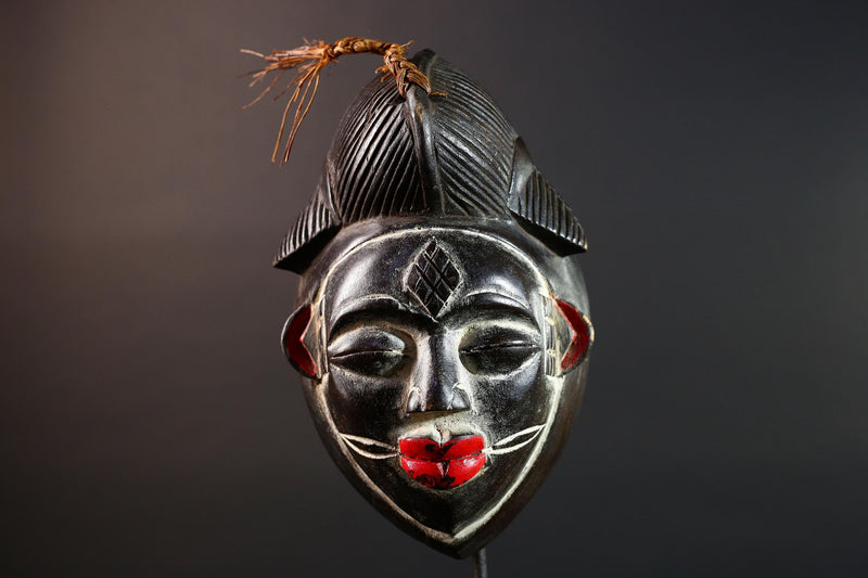 Punu tribal carving with red lips, black wood mask with fiber crest, ancestral spirit face art, African wall decor sculpture G5570