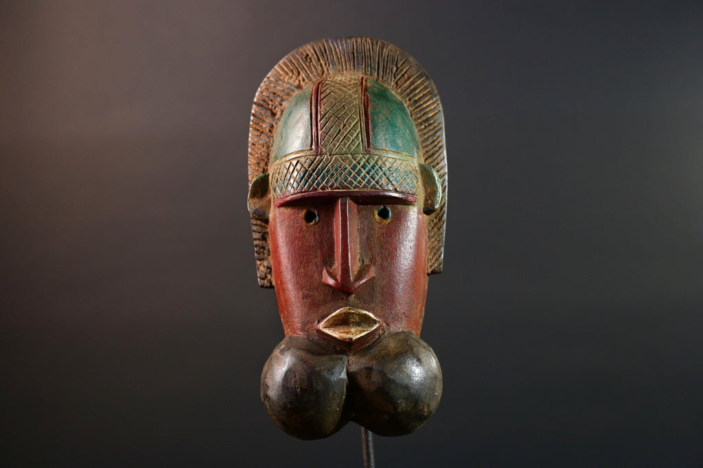African mask Songye tribal decor with carved geometric features, red angular face, and bold cheek shapes wall hanging sculpture G5572