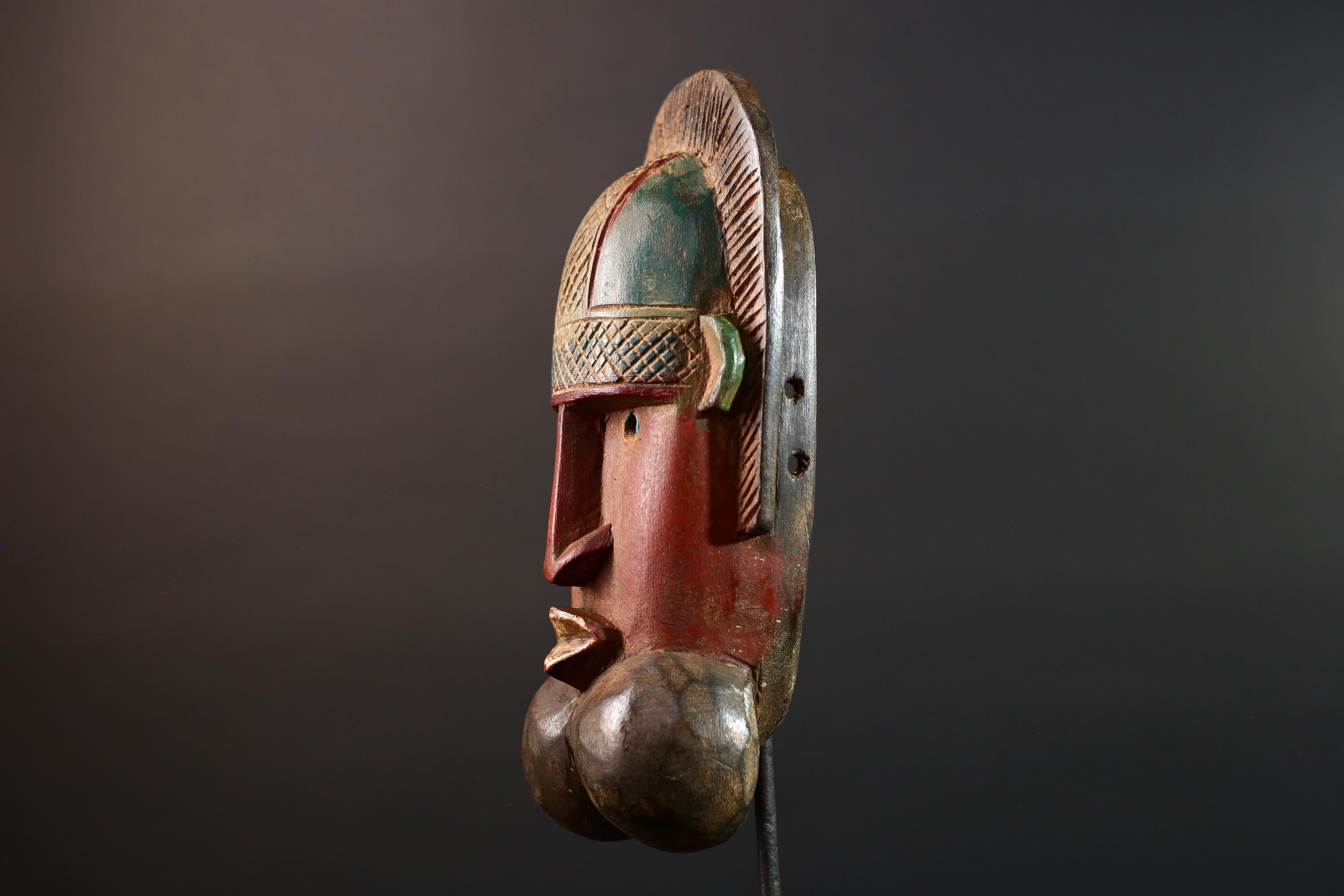 African mask Songye tribal decor with carved geometric features, red angular face, and bold cheek shapes wall hanging sculpture G5572