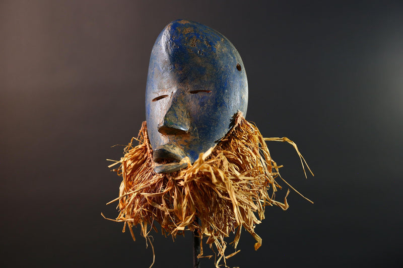 African mask Dan blue face with raffia fringe, slitted eyes, tribal carving from Côte d’Ivoire for ceremonial wall art or decor G5576