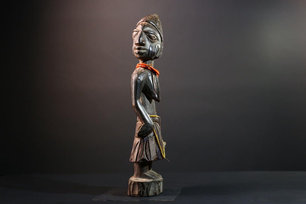 African statue Yoruba carved female figure from Nigeria with beads, tribal details, and dark finish for spiritual home decor G5561