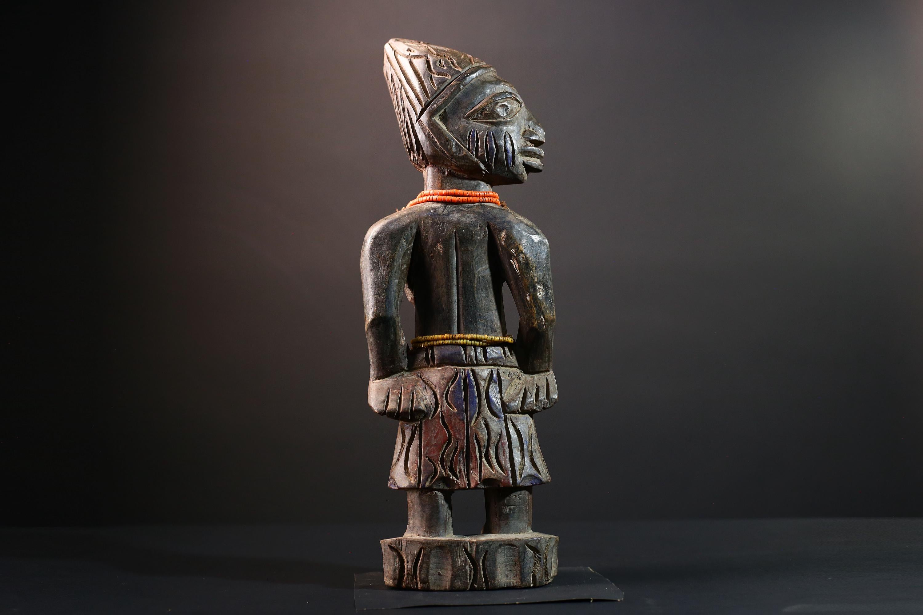African statue Yoruba carved female figure from Nigeria with beads, tribal details, and dark finish for spiritual home decor G5561