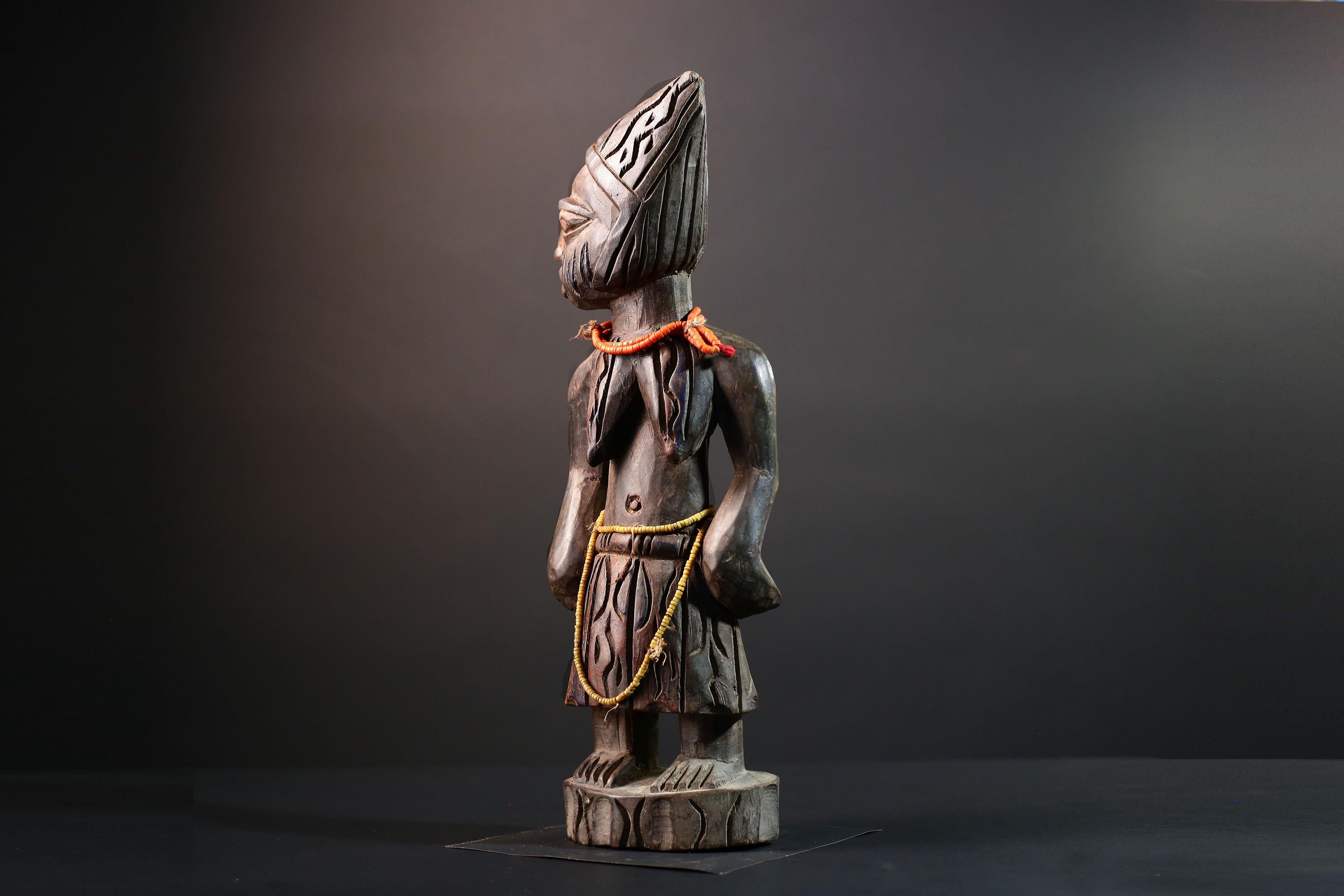 African statue Yoruba carved female figure from Nigeria with beads, tribal details, and dark finish for spiritual home decor G5561