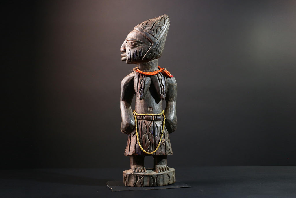 African statue Yoruba carved female figure from Nigeria with beads, tribal details, and dark finish for spiritual home decor G5561
