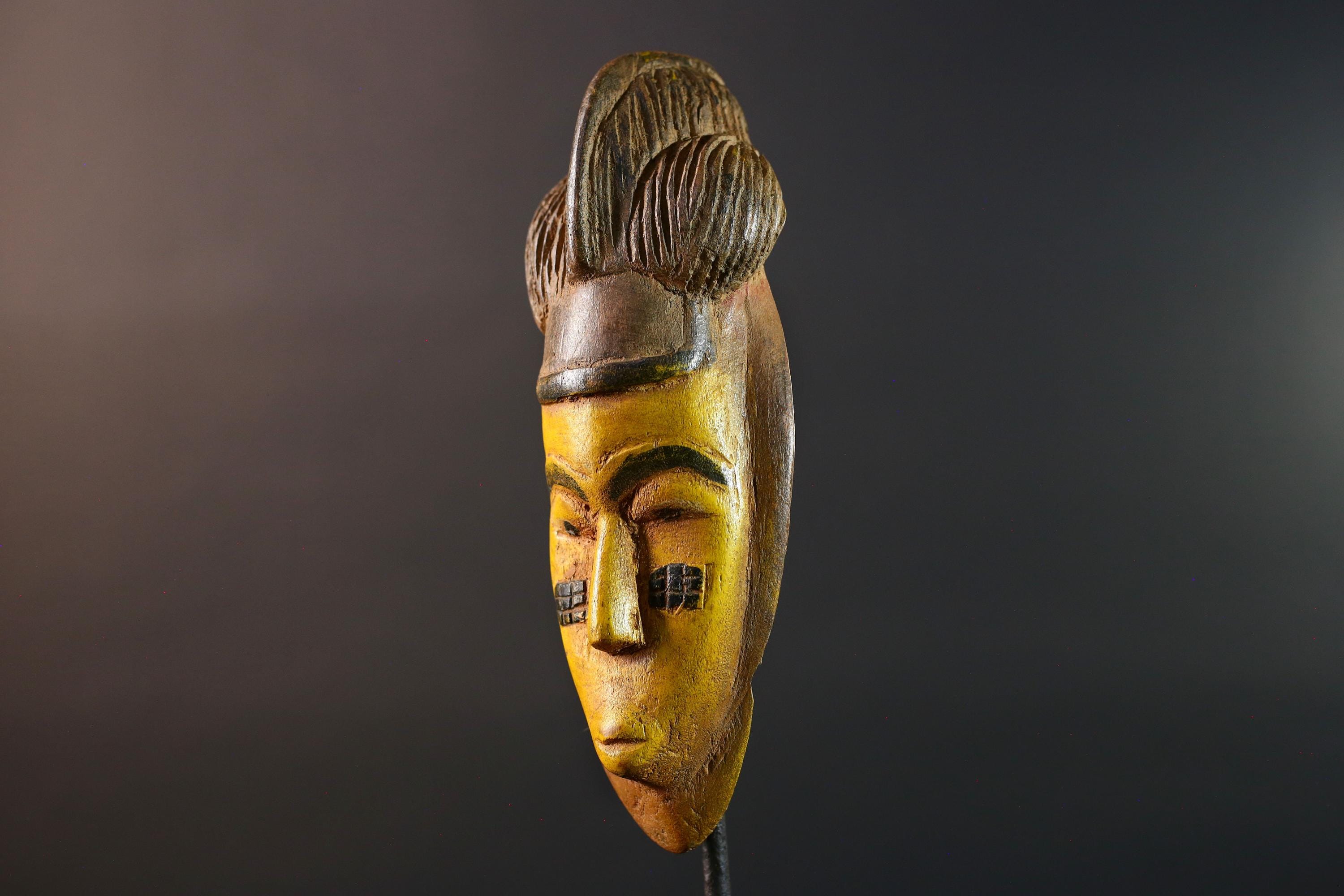 African mask Baule yellow wall sculpture tribal face carving cultural artifact leaf crest decor artisan African wood art piece G5565