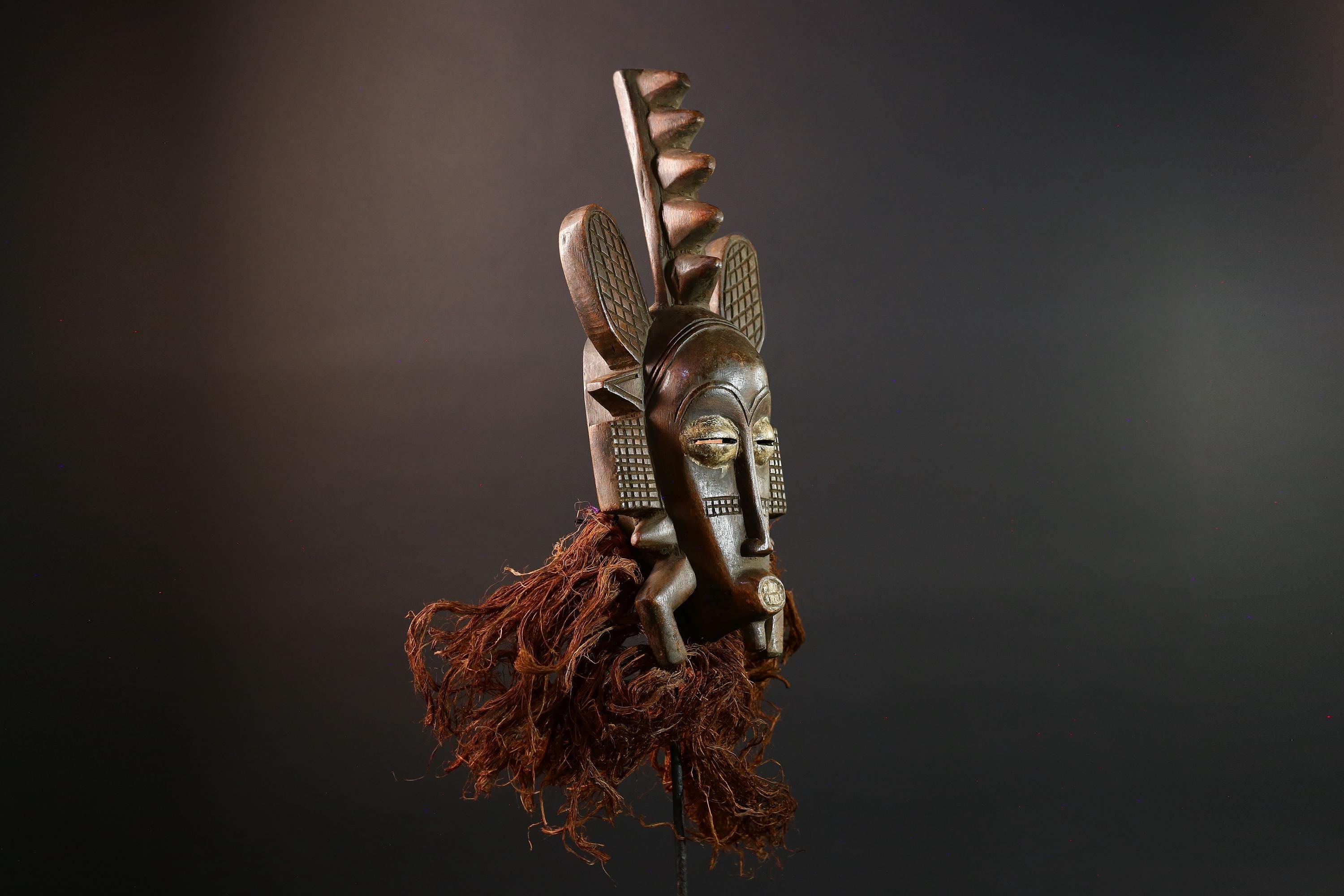 African mask Senufo tribal warrior face carving with raffia beard tall crest art cultural wall decor bold ceremonial mask sculpture G5578