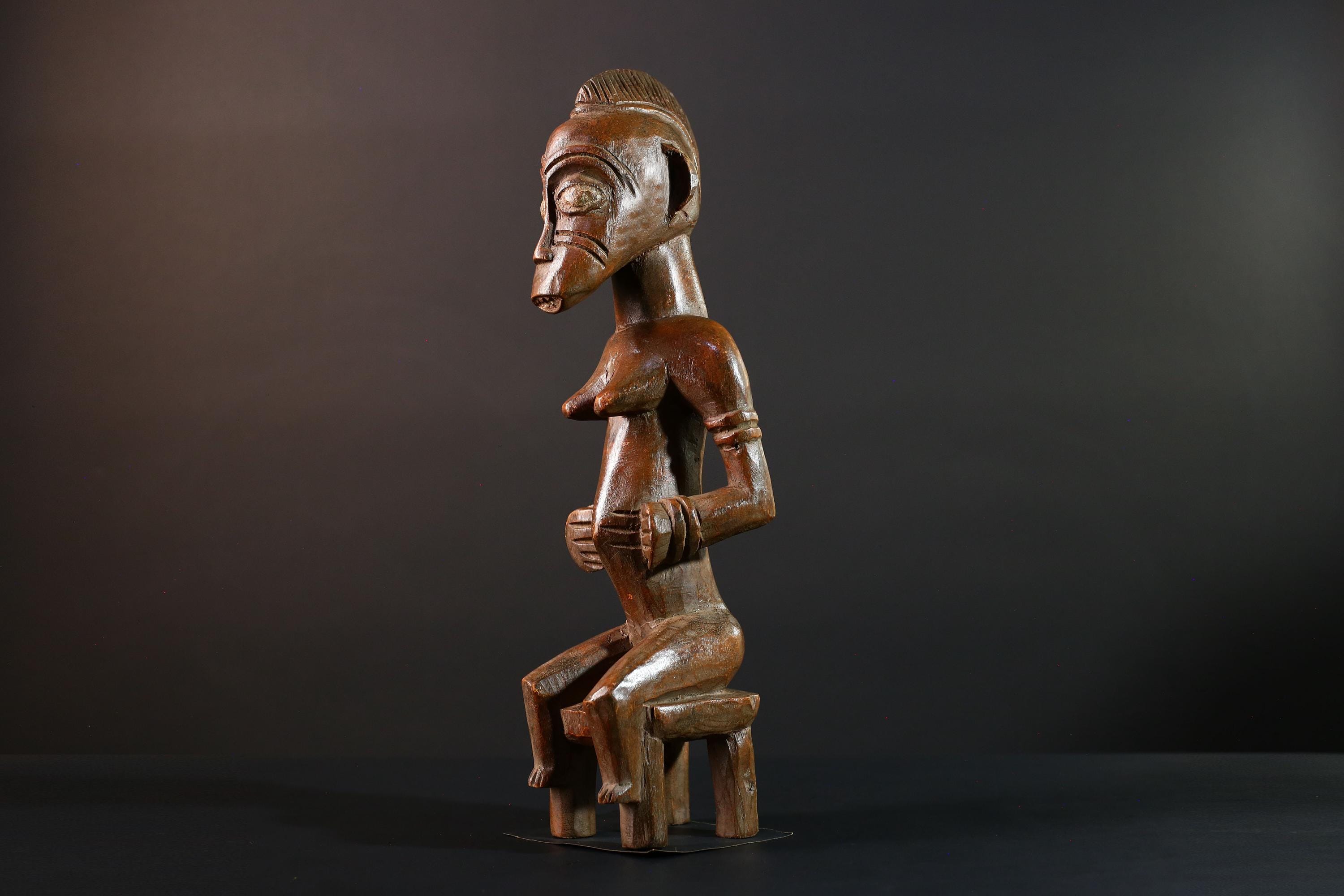 African Yoruba female figure seated on stool carved tribal fertility sculpture from Nigeria altar decor spiritual wood art-G5640