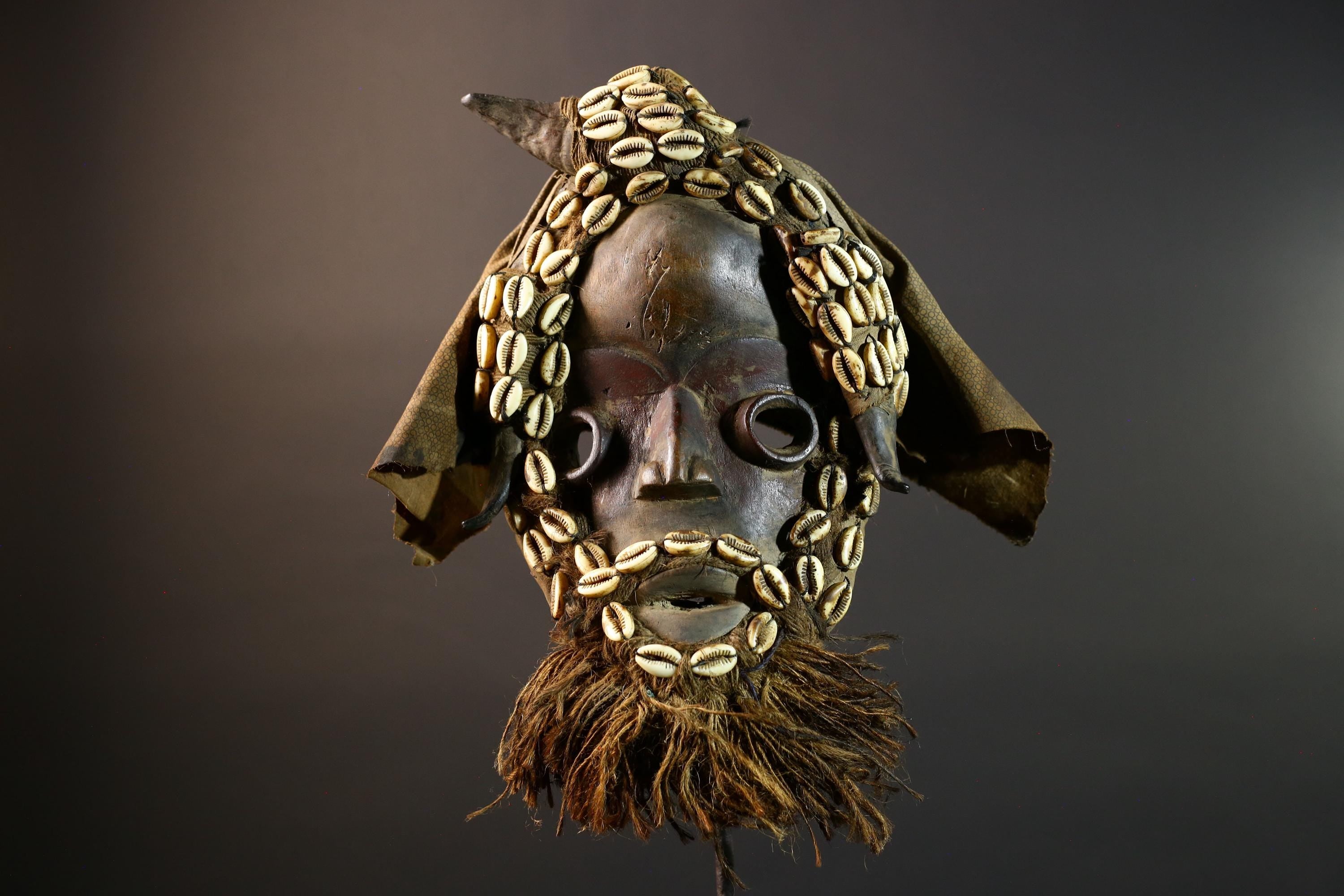 African Dan Mask Handcrafted Tribal Wood Wall Decor Authentic Cultural Art Sculpture with Cowrie Shells and Raffia Beard-G5693